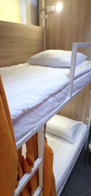 Postel nebo postele na pokoji v ubytování Hostel Capsule