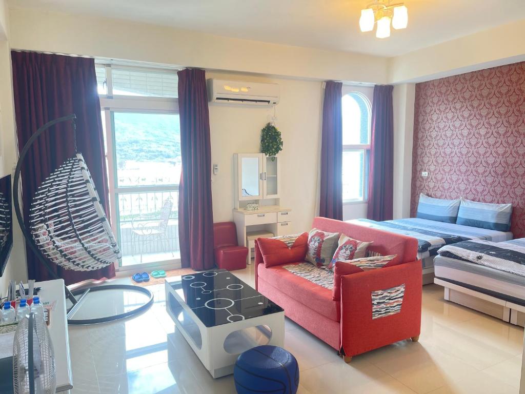 Uma área de estar em Holiday Homestay