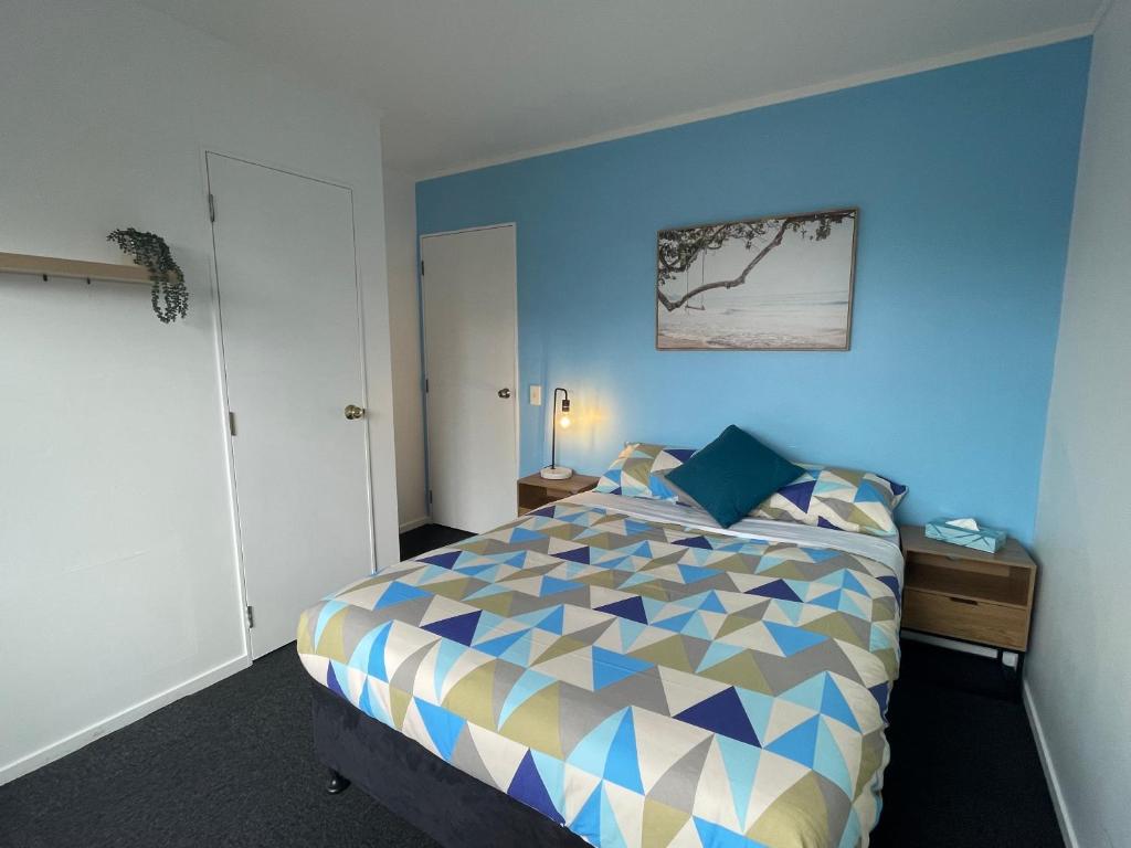 Letto o letti in una camera di Palm Tree Lodge