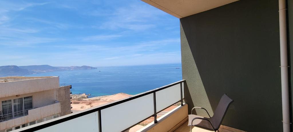 a balcony with a view of the ocean at Akid lotfi Oran in Oran