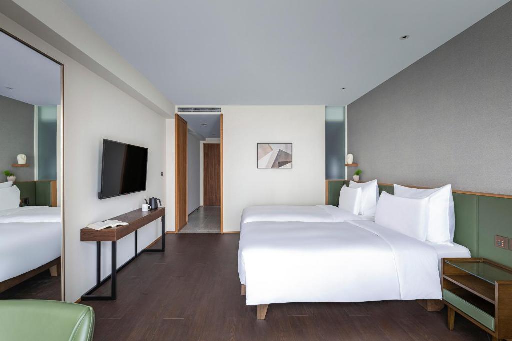 Postel nebo postele na pokoji v ubytování Humble Boutique Hotel