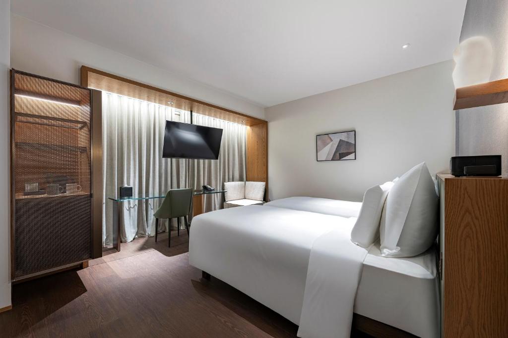 Postel nebo postele na pokoji v ubytování Humble Boutique Hotel
