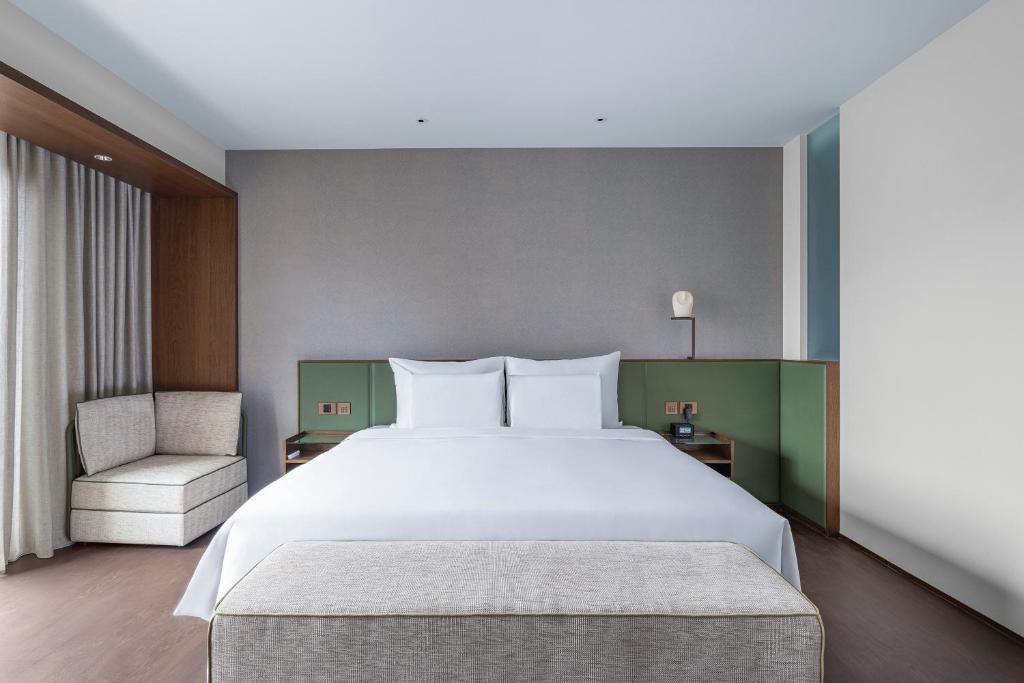 Postel nebo postele na pokoji v ubytování Humble Boutique Hotel