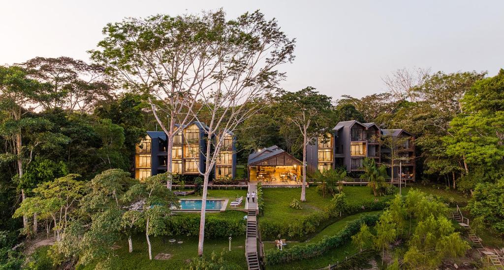 an aerial view of a house in the forest at Hotel Enai in Puerto Maldonado