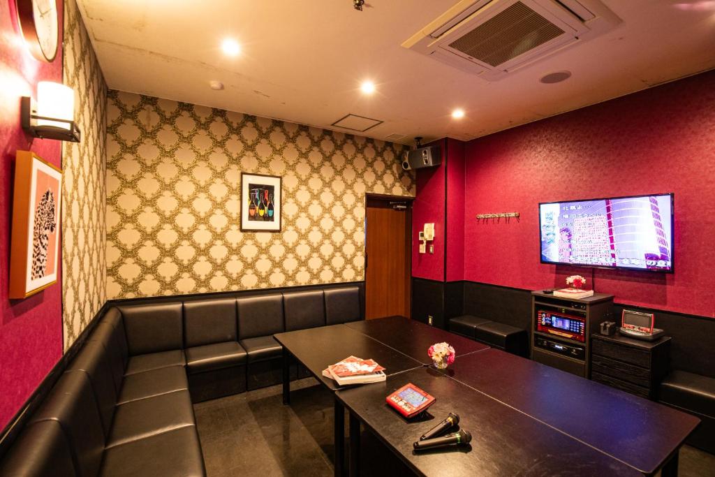 TV a/nebo společenská místnost v ubytování Motosu Phoenix Hotel