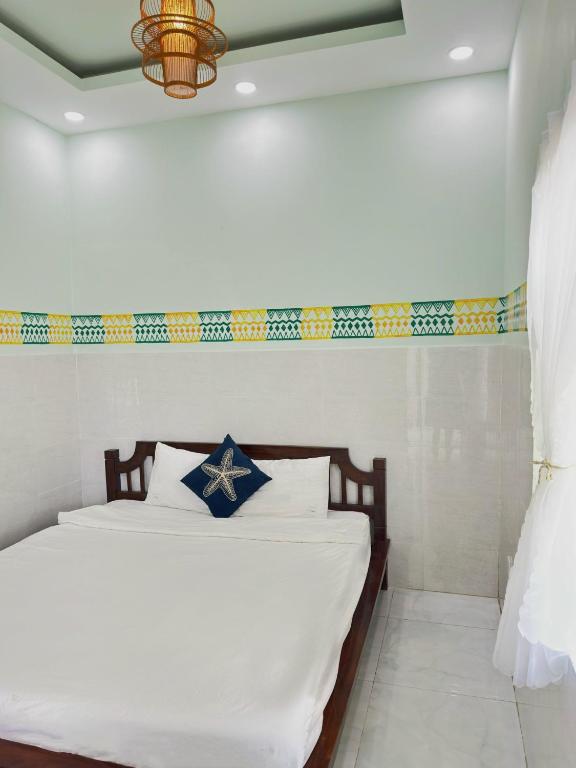 Postel nebo postele na pokoji v ubytování Hacoda Homestay