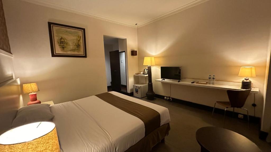 Postel nebo postele na pokoji v ubytování Bali World Hotel