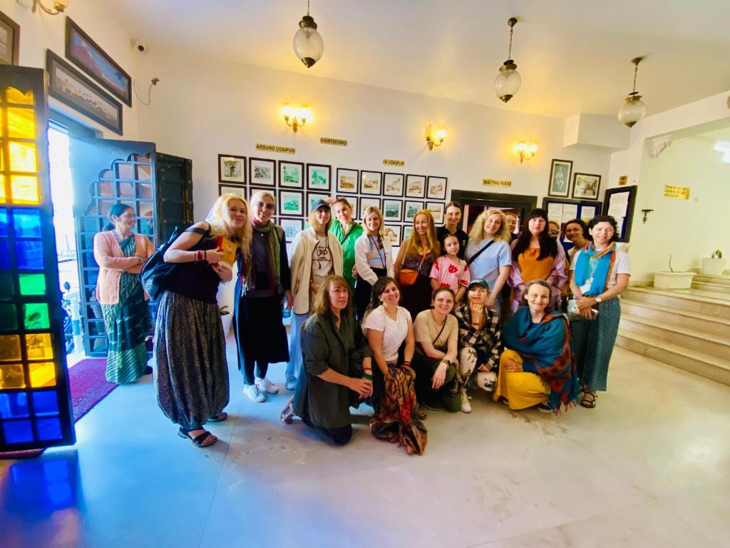 a group of people posing for a picture in a room at Kotra Haveli A Boutique Hotel by Lake Pichola in Udaipur