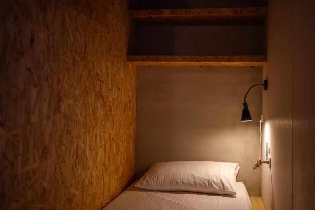 Postel nebo postele na pokoji v ubytování Slow Island Hostel