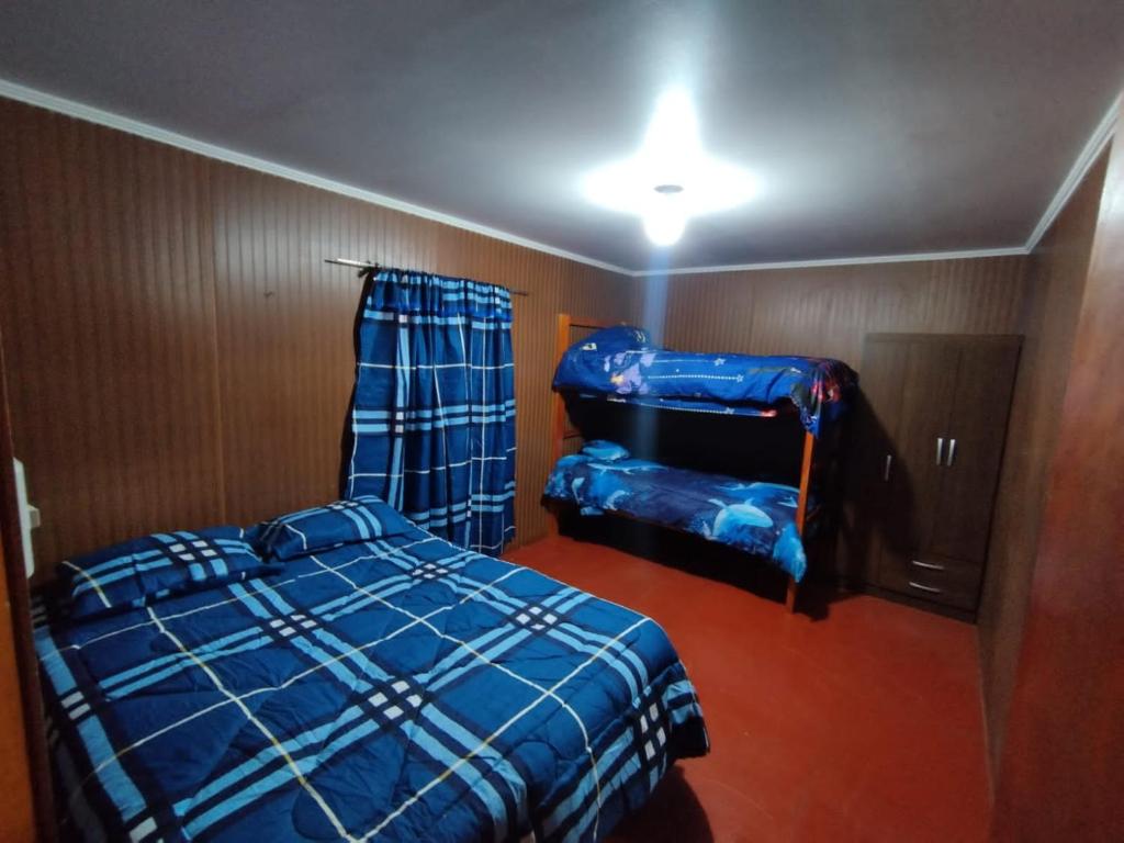 a bedroom with two beds in a room at CASA EN LOS VERDES in Iquique