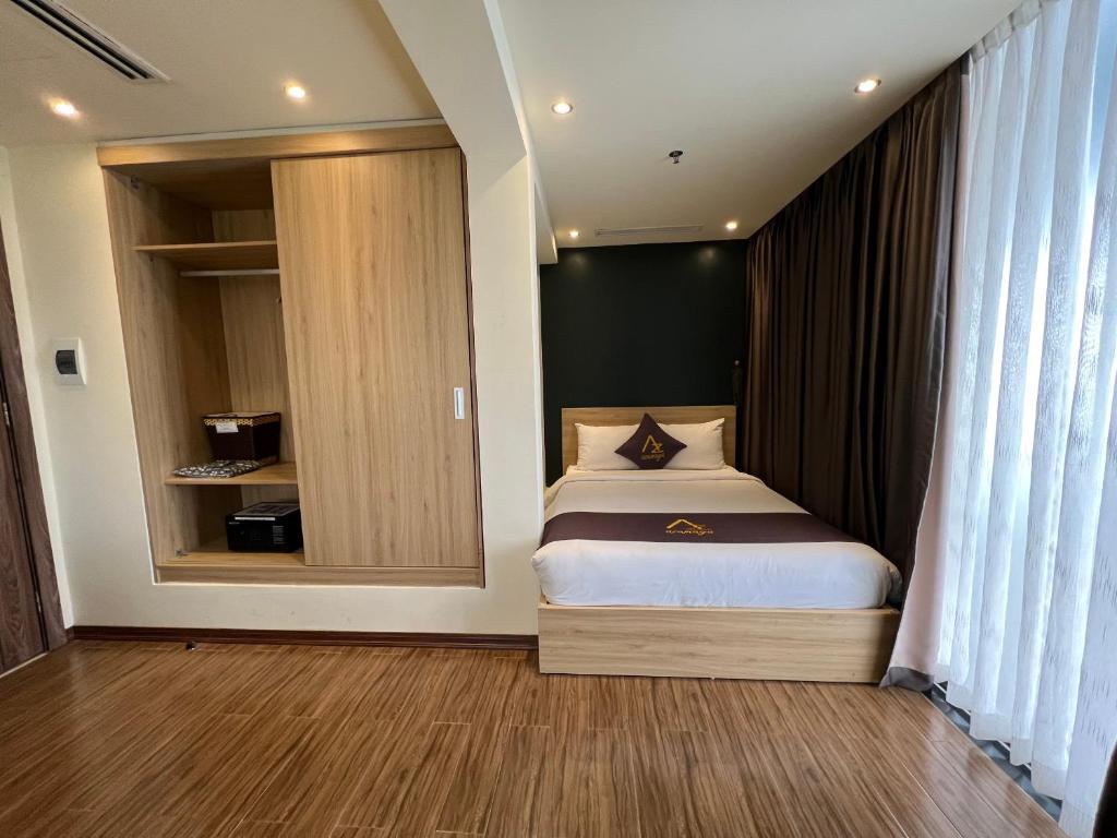 Krevet ili kreveti u jedinici u okviru objekta Azumaya Hotel Hai Phong