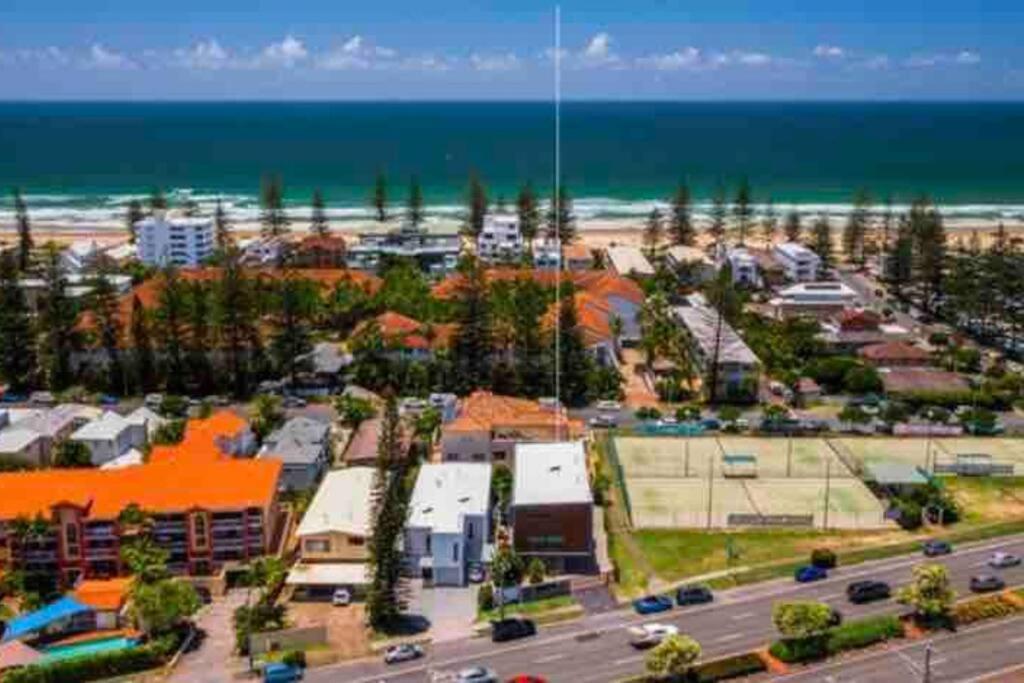 an aerial view of a parking lot next to the beach at Casa De Mork - Entire 3 Storey Beach Villa in Gold Coast