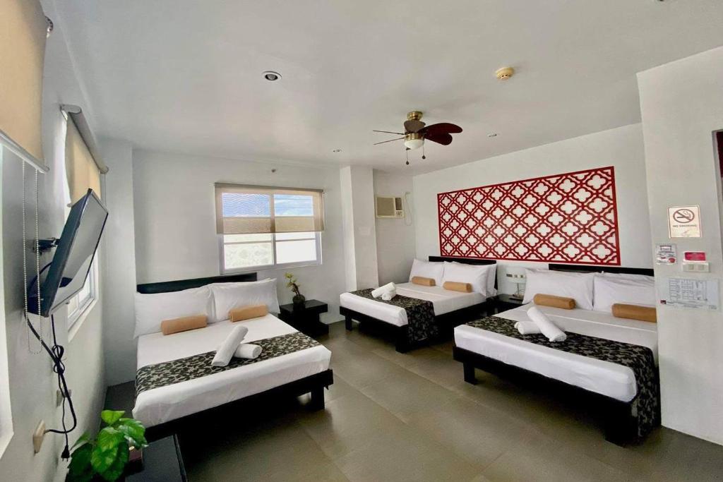 Postel nebo postele na pokoji v ubytování Micasa Lodge Palawan