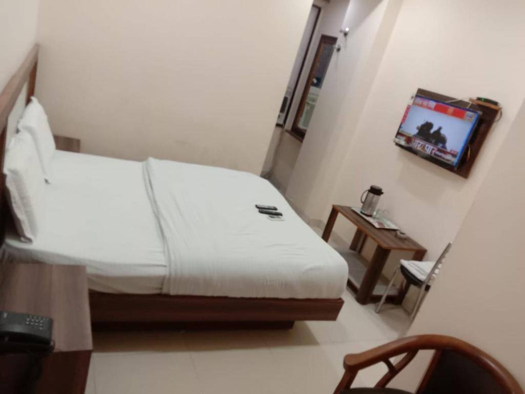 Tempat tidur dalam kamar di Hotel Dada intdxin