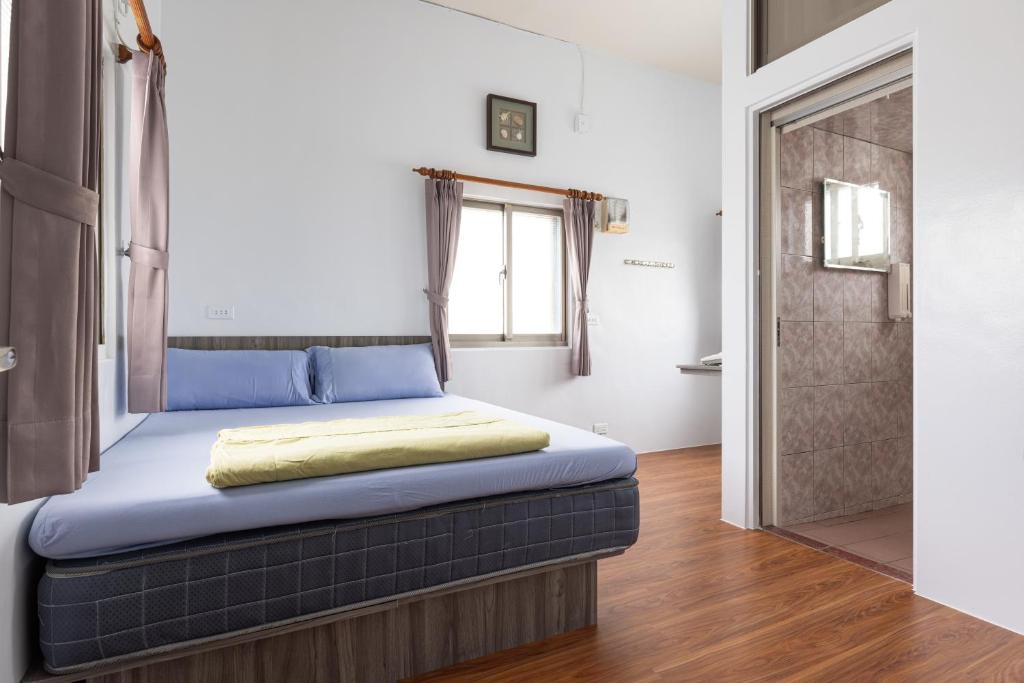 Postel nebo postele na pokoji v ubytování Jinshawan B&B