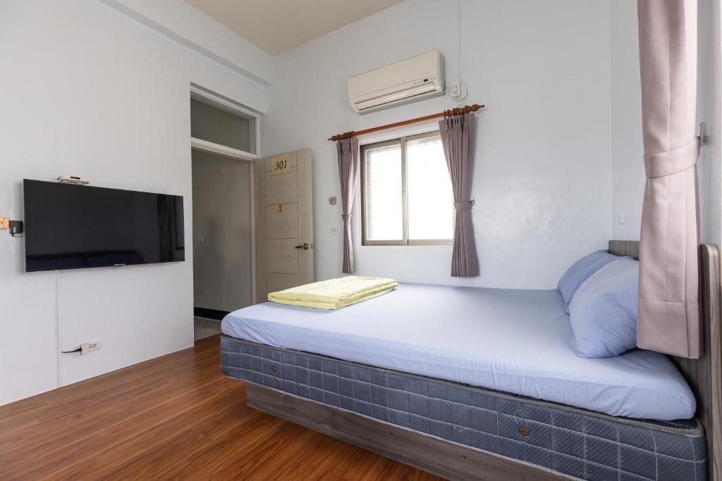 Postel nebo postele na pokoji v ubytování Jinshawan B&B