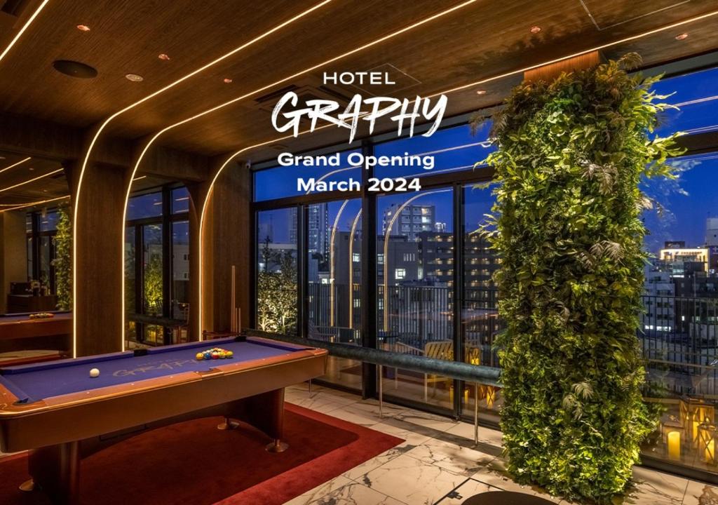 a pool table in the lobby of a hotel grand opening at HOTEL GRAPHY Shibuya in Tokyo