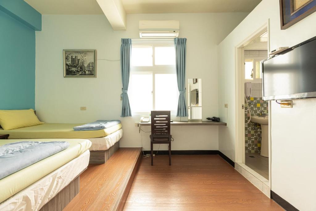 Postel nebo postele na pokoji v ubytování Jinshawan B&B