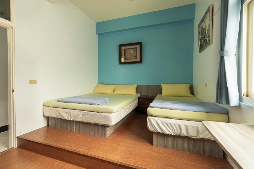 Postel nebo postele na pokoji v ubytování Jinshawan B&B