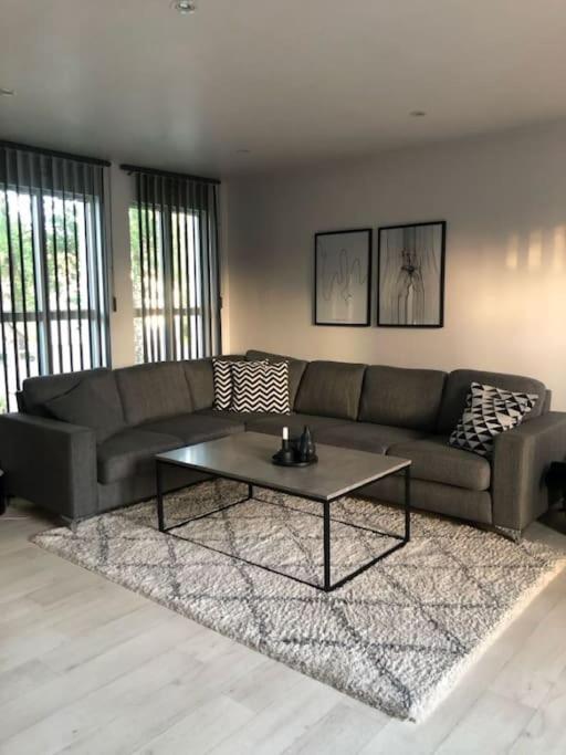 a living room with a couch and a coffee table at Hus sentralt på sentrum in Alta