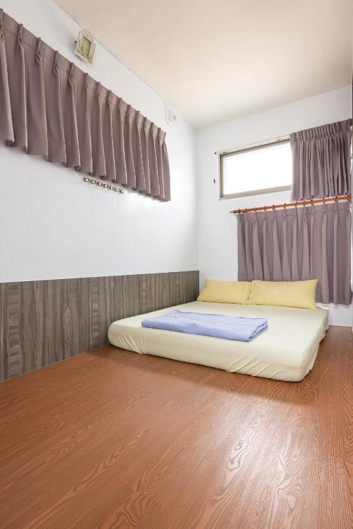Postel nebo postele na pokoji v ubytování Jinshawan B&B