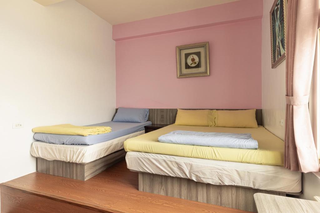 Postel nebo postele na pokoji v ubytování Jinshawan B&B