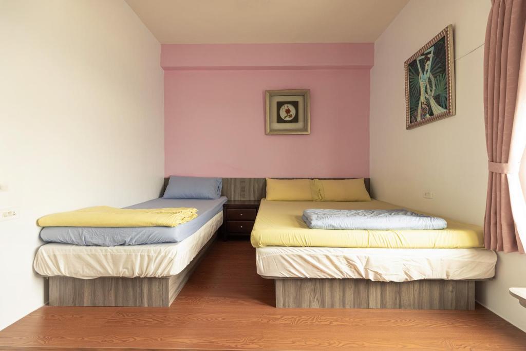 Postel nebo postele na pokoji v ubytování Jinshawan B&B