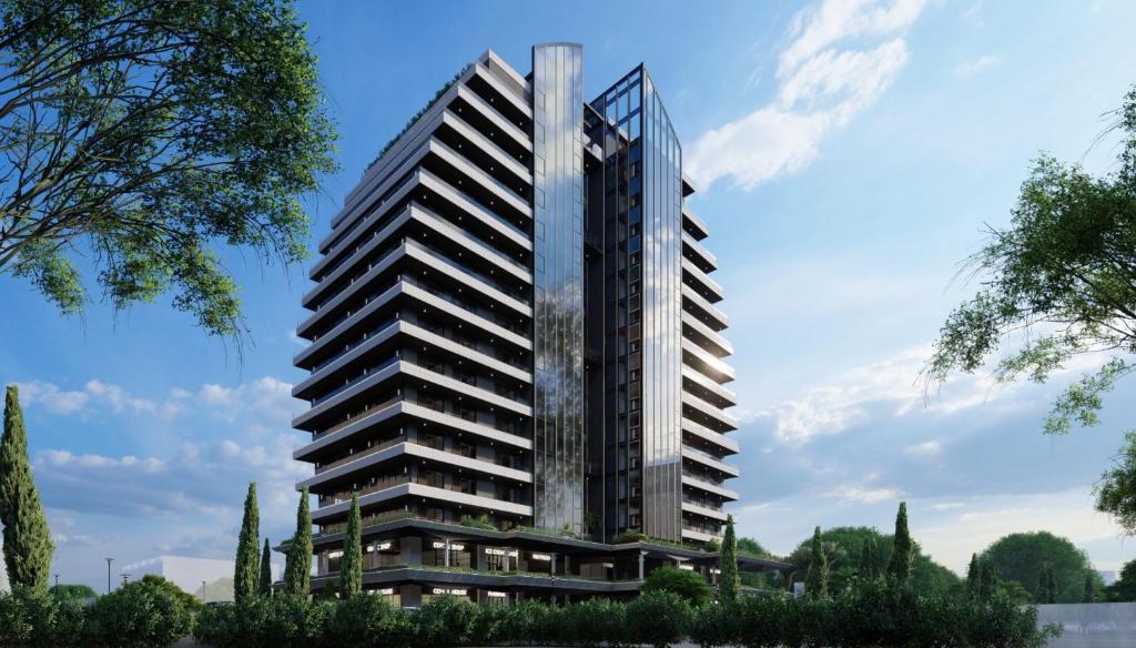 a rendering of a tall building at Deluxe Studio Apartments at Kass Towers Accra - Upper Floor By VP Properties in Accra