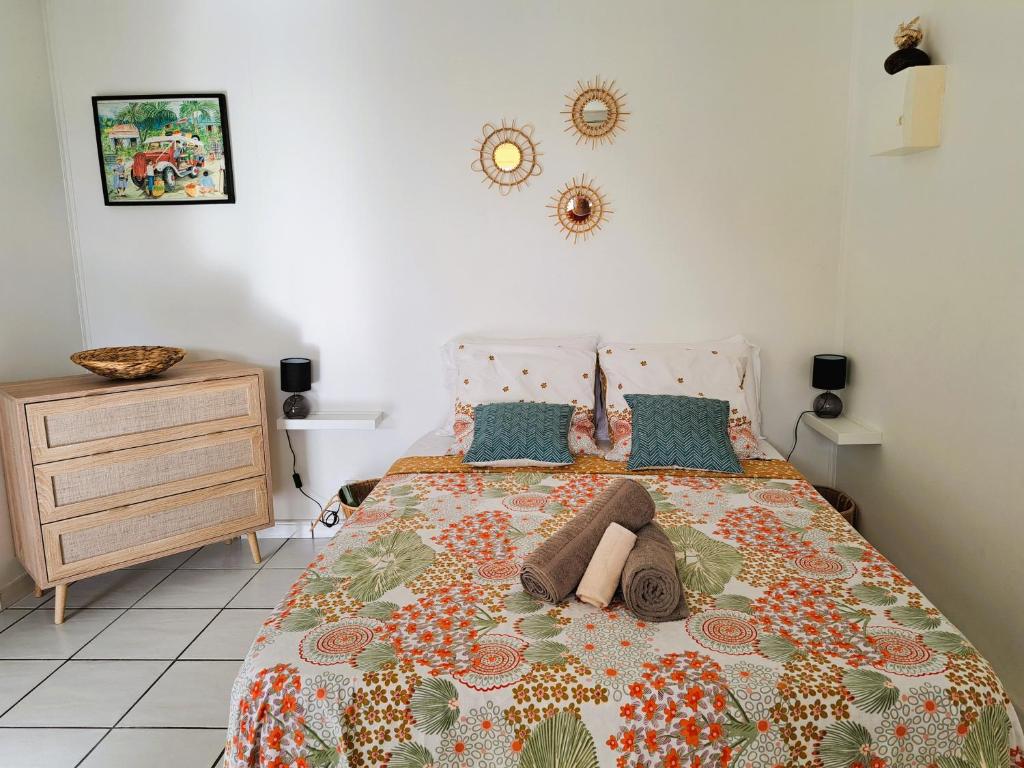 Postel nebo postele na pokoji v ubytování Bungalow Jazz - Bassin Manapany-Les-Bains