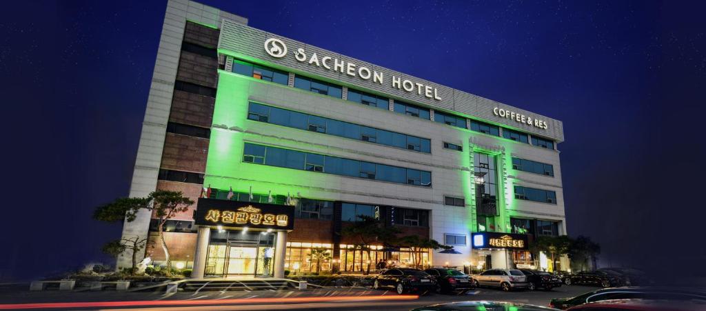 a hotel with green lights on the front of it at Sacheon Tourist Hotel in Sacheon