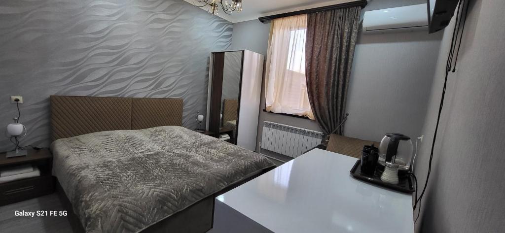 Postel nebo postele na pokoji v ubytování Ahana Hotel