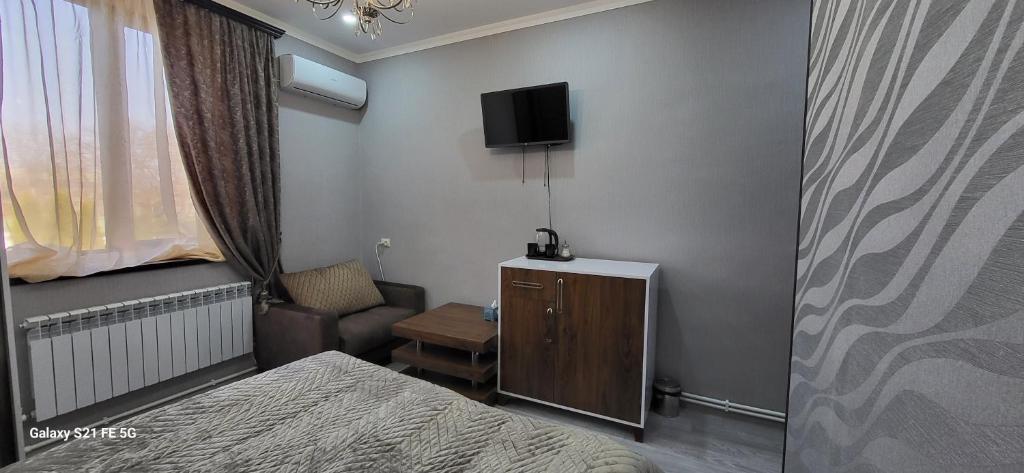 TV a/nebo společenská místnost v ubytování Ahana Hotel