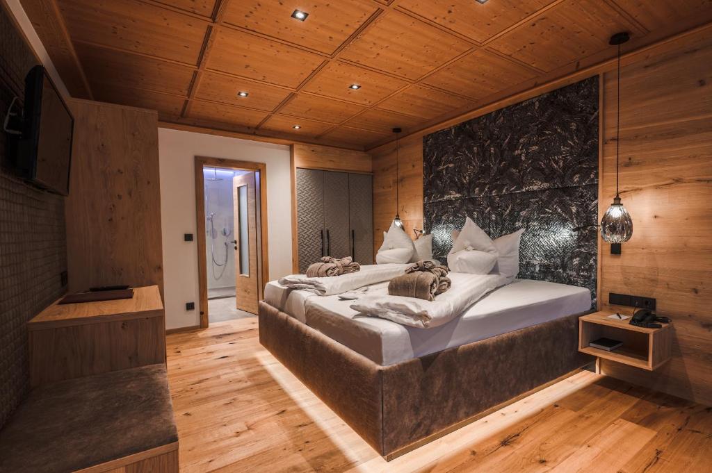 Postel nebo postele na pokoji v ubytování Hotel Unterwirt