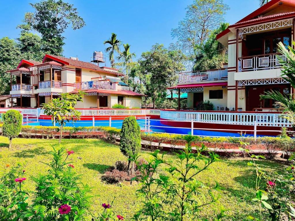 a house with a garden in front of it at Hotel Hermitage in Sauraha