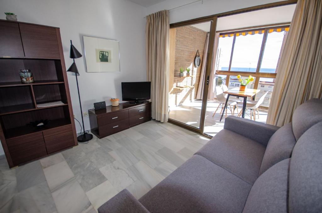 A seating area at ARENA 8 Levante Beach