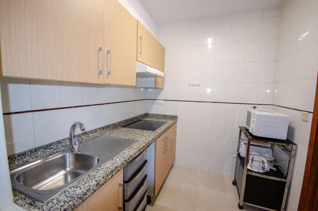 A kitchen or kitchenette at ARENA 8 Levante Beach