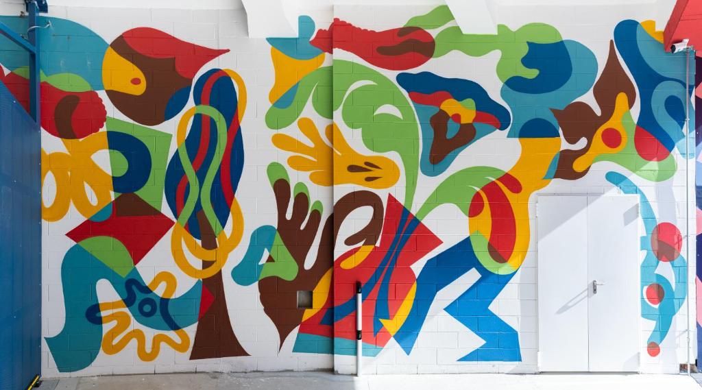 a mural on the side of a wall at aparto Milan Ripamonti in Milan