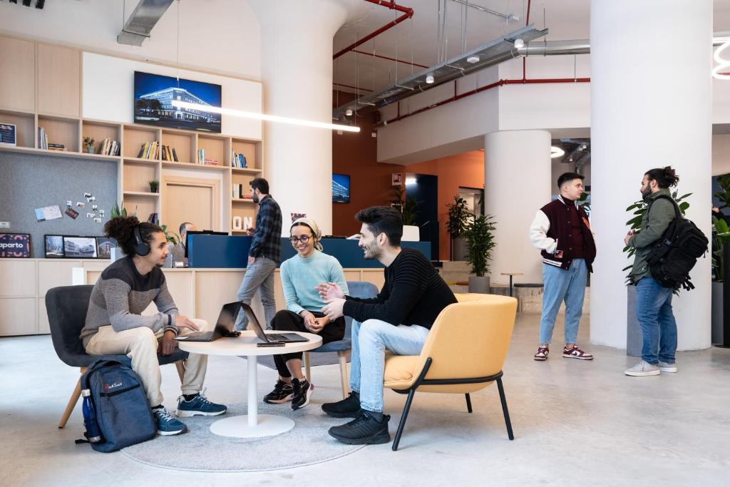 a group of people sitting in a room at aparto Milan Ripamonti in Milan