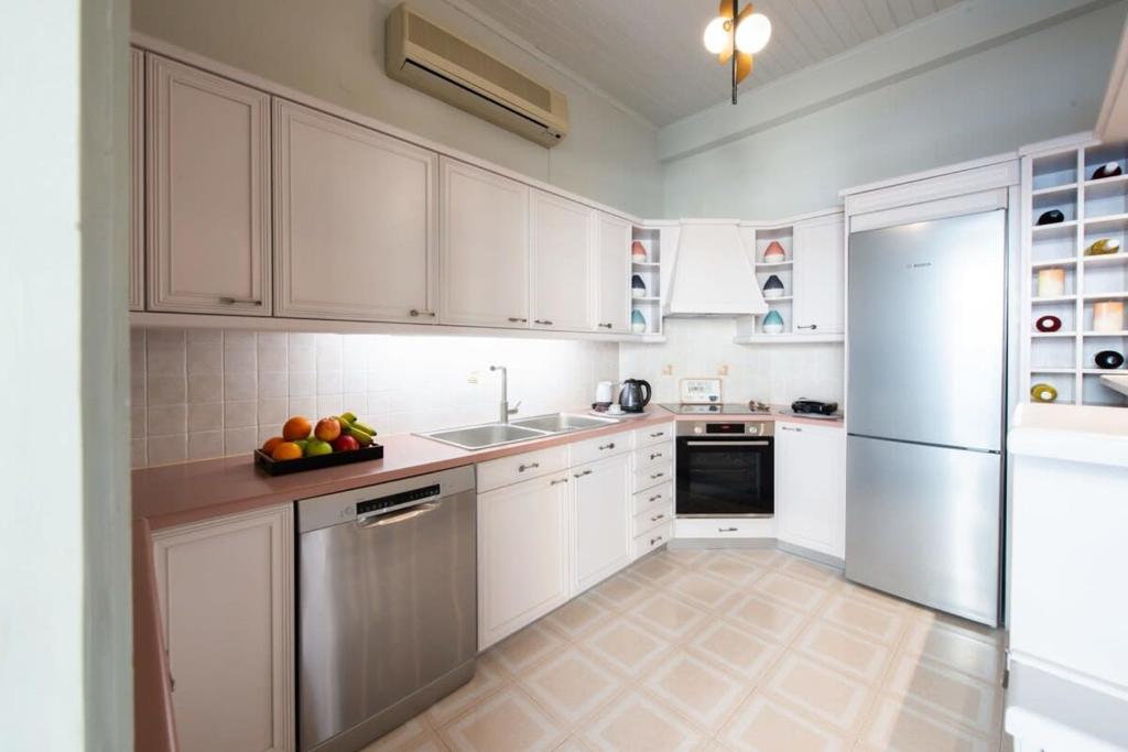 A kitchen or kitchenette at Dolce Favola Nomad Casa - Kalamata's City Getaway
