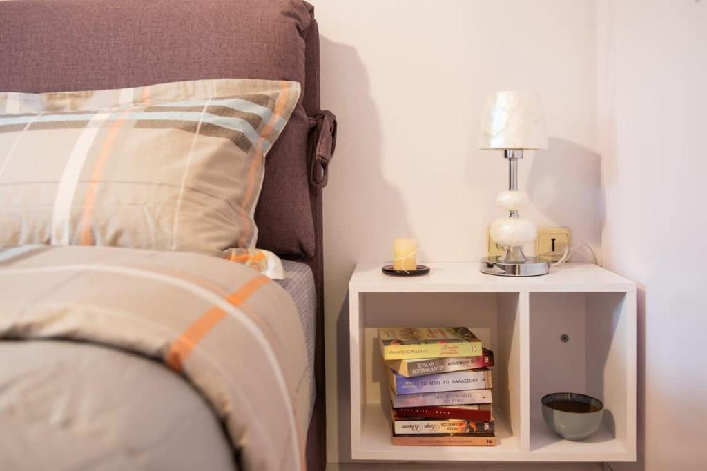 A bed or beds in a room at Dolce Favola Nomad Casa - Kalamata's City Getaway