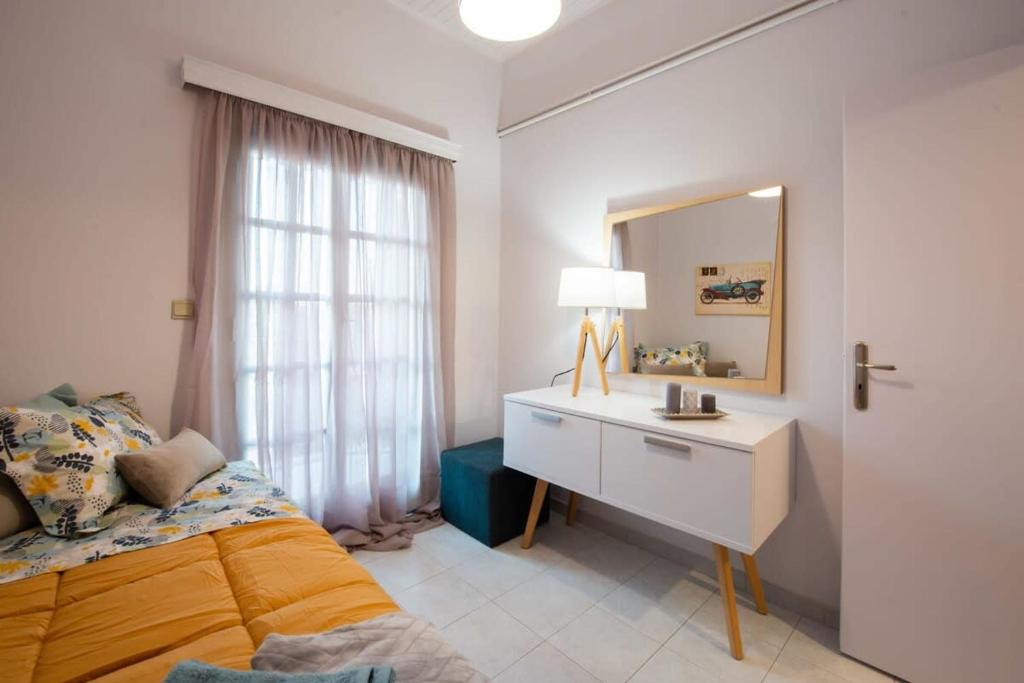 A bed or beds in a room at Dolce Favola Nomad Casa - Kalamata's City Getaway