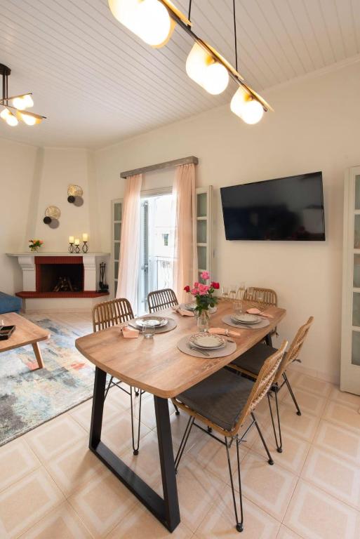 A television and/or entertainment centre at Dolce Favola Nomad Casa - Kalamata's City Getaway