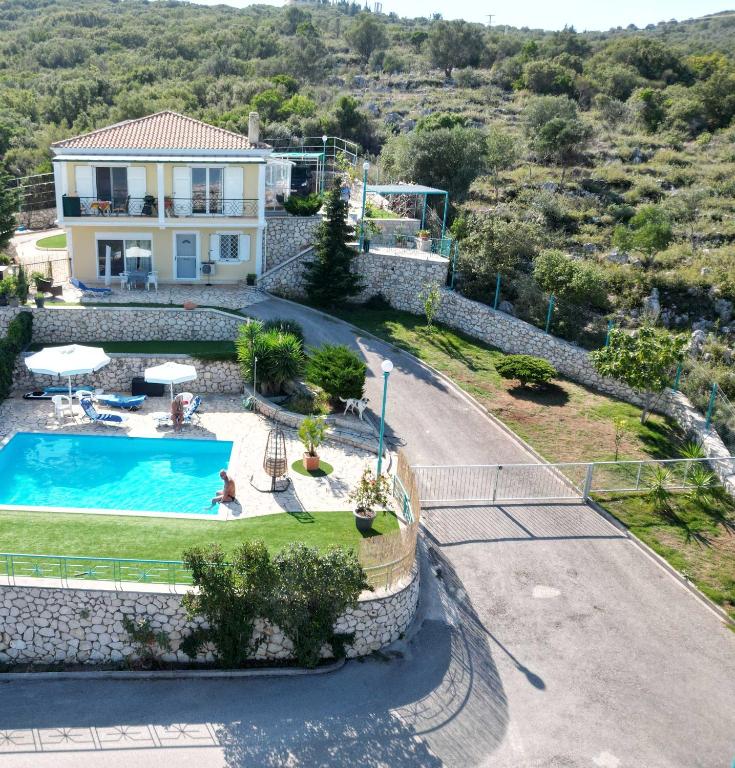 an image of a villa with a swimming pool at Villa Claudia in Apolpaina