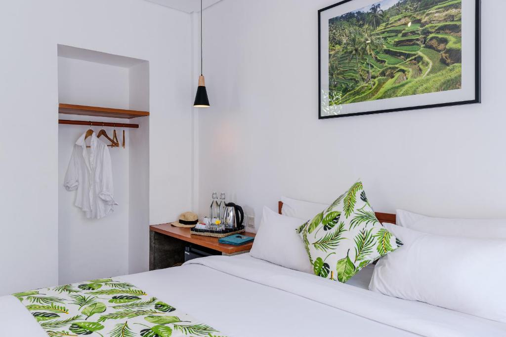 Postel nebo postele na pokoji v ubytování Chandi Hotel Ubud