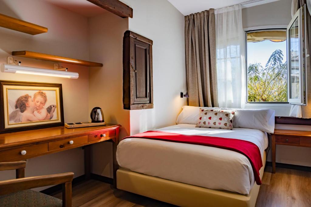 Postel nebo postele na pokoji v ubytování Hotel Cortijo Landete