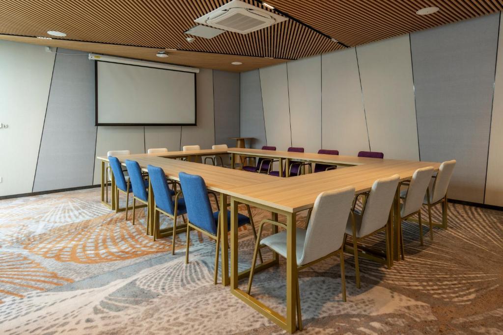 a conference room with a long table and chairs at TTC Van Phong Bay Resort - Himalaya Sauna & Steam Retreat Included in Ninh Hòa