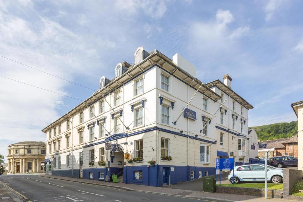 a white building on the side of a street at Great Malvern Hotel in Great Malvern