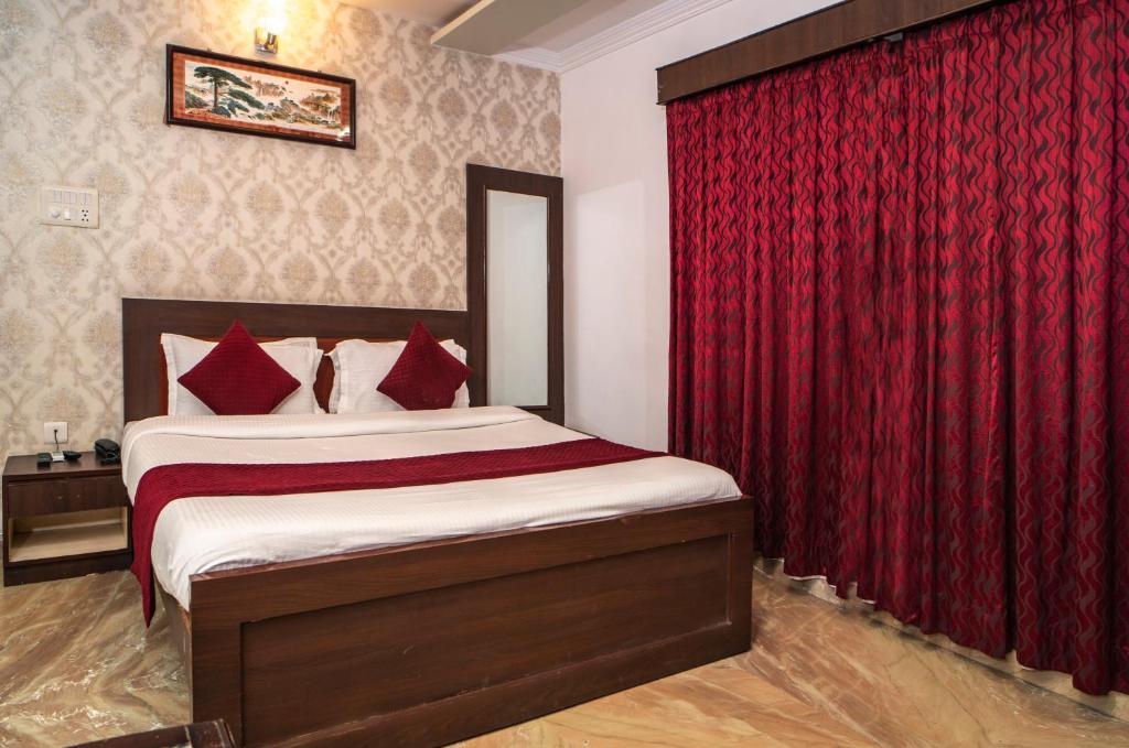 Postel nebo postele na pokoji v ubytování Florence Continental Udaipur