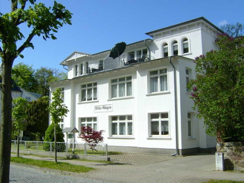 a large white building with windows on a street at "Villa Rügen" - 300 m zum Strand in Binz