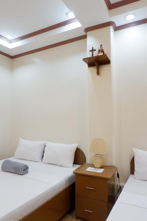 Postel nebo postele na pokoji v ubytování JUN's INN